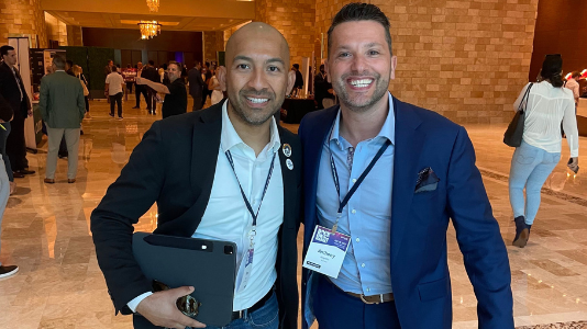 Anthony Angelillo with a colleague at an industry conference