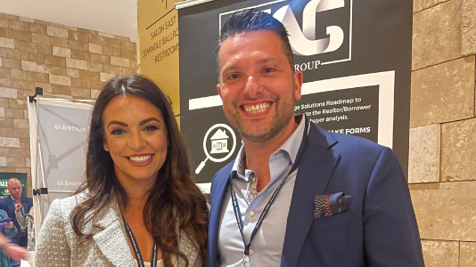 Anthony Angelillo with a colleague at the TAG booth at an industry event