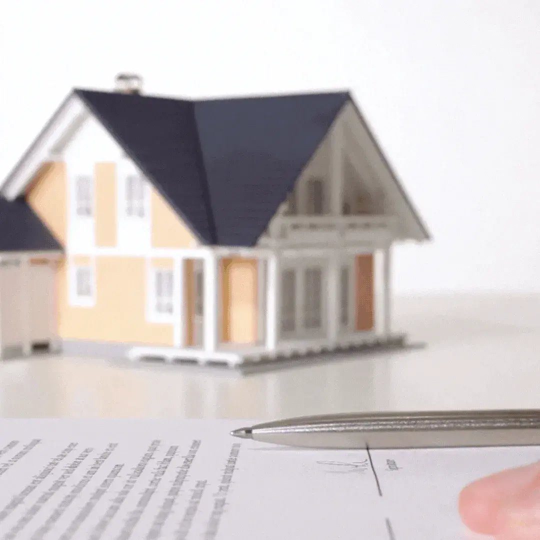 Model house on mortgage documents